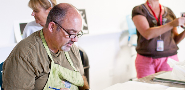 Image of adult students working on projects.