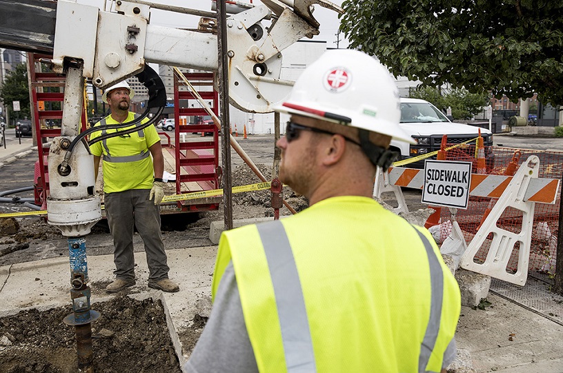 construction workers with drill