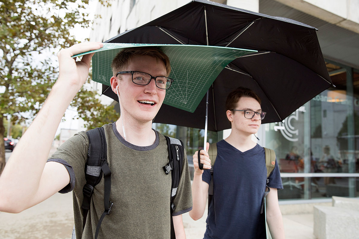 students use supplies in rain