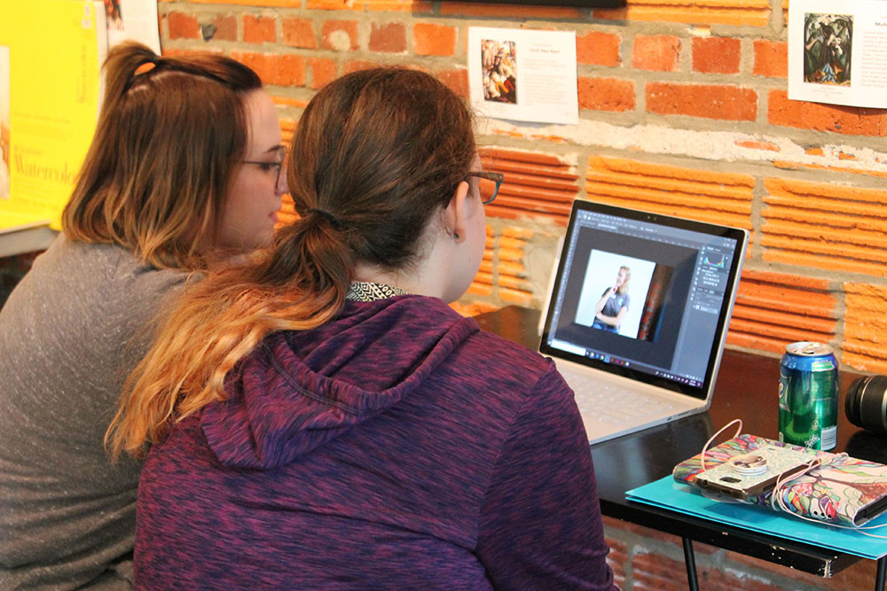 Students looking at a computer