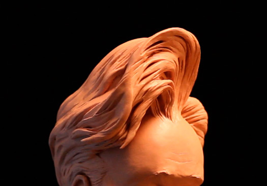 Film & Video, close up of exaggerated sculpture rendering of Conan O' Brien's iconic swooped hair-do 