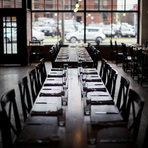 Life at CCAD, Interior shot of tables and chairs with window overlooking street in Wolf's Ridge Brewery near CCAD