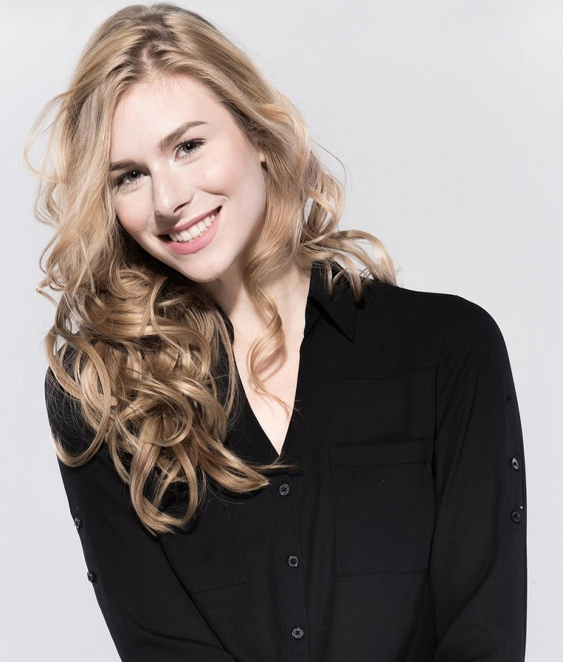 Industrial Design, Headshot of Alexa Hanna from the waist up wearing a long sleeve black top against a white backdrop