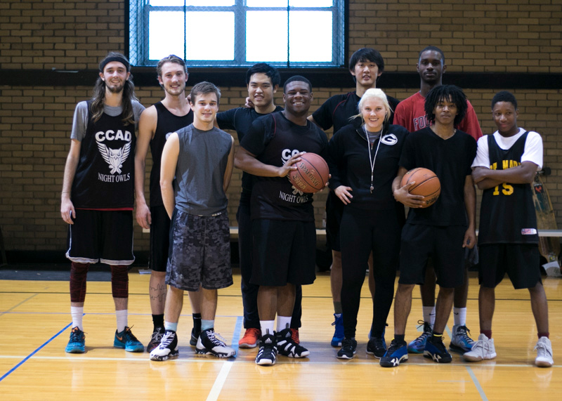 Life at CCAD, Photo of students on basket ball team posing together for photo in athletic clothes on basketball court