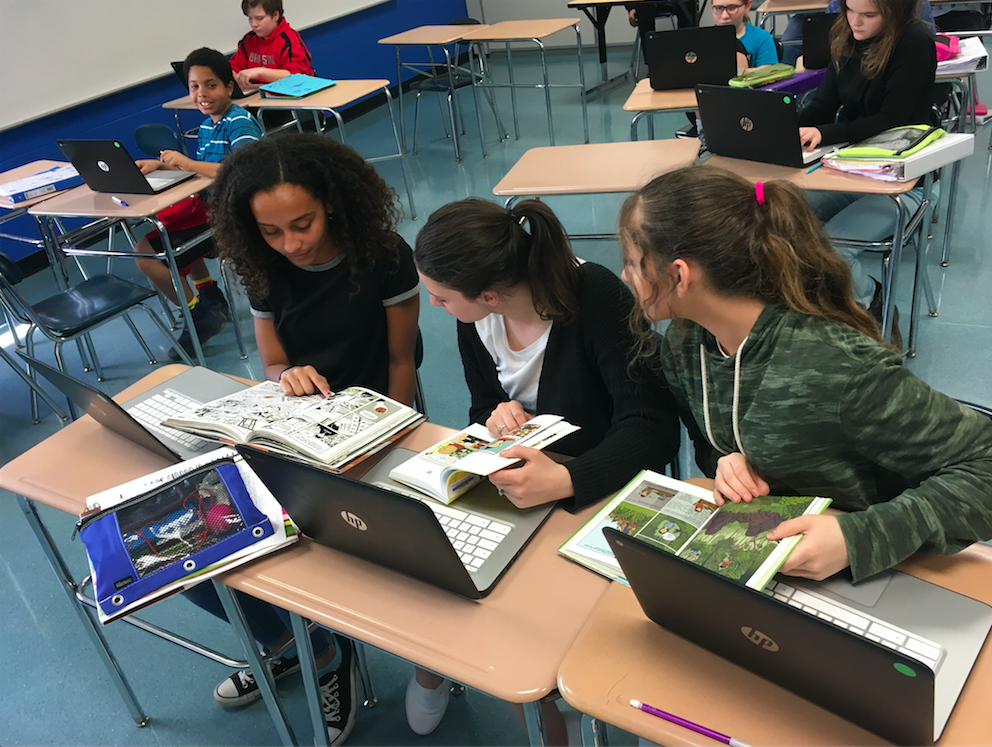 Illustration, students work on laptops at desks in a classroom