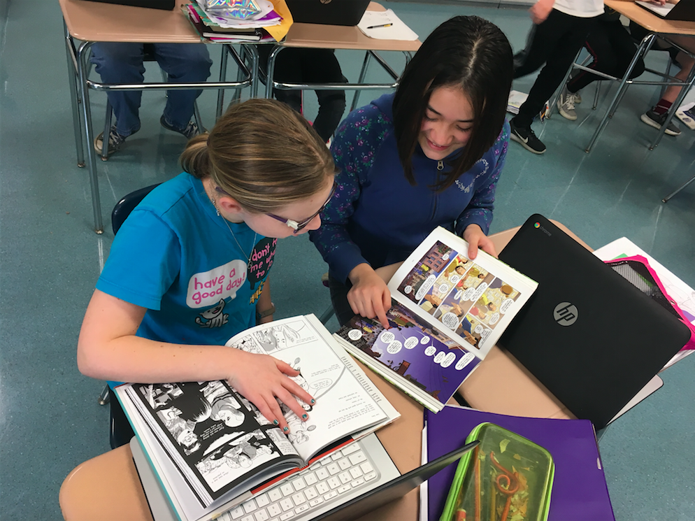 Illustration, two students pore of comic books at a desk