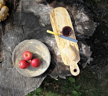 Interior Design, Wooden bread board on a wooden table with a plate of three apples