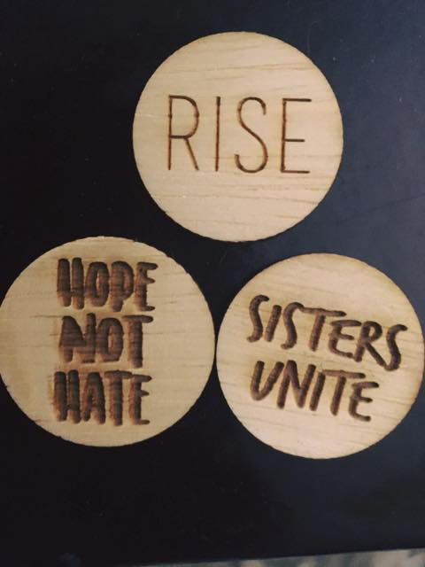 Photography, Three Wooden, laser cut Buttons on a black backdrop