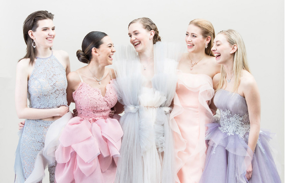 Fashion Design, Five models laughing and posing in pastel gowns