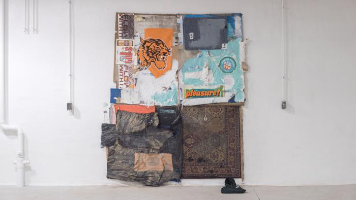 Fine Arts, Fabric collage of rugs and ads hanging on a gallery wall