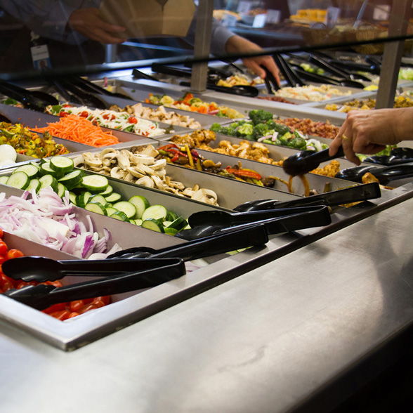 Life at CCAD, Photo of metal salad bar stocked with vibrant vegetables at Hills Market in downtown Columbus