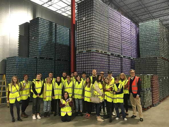 Advertising & Graphic Design, Image of students and instructor from Advanced Branding course on site at BrewDog in safety vests