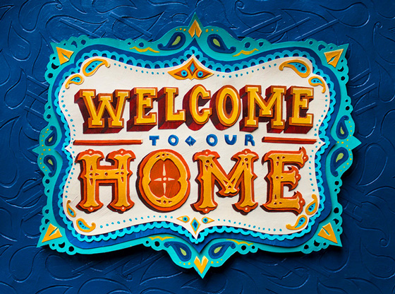 Illustration, Advertising & Graphic Design, Image of cut paper and paint sign that reads "Welcome to our home" In red and yellow carnival style letters