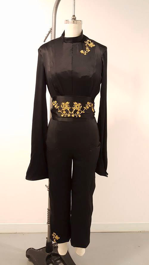 Fashion Design, Black long sleeve jumpsuit on mannequin with gold accents and details