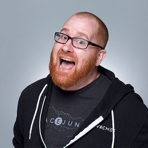 Film & Video, Animation, Headshot of Kevin Rapp in black hoodie and gray tshirt against a blue gray background