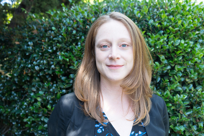 Life at CCAD, Photograph of Lisa Stoneman in front of backdrop of greenery