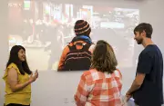 Image of student discussing work in a gallery space