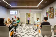 Patients sitting in waiting room at Equitas Health King-Lincoln Medical Center