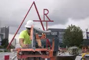 cutting bricks under art sign