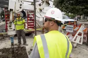 construction workers with drill