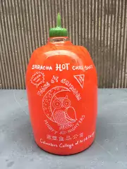 Glass Sriracha hot sauce bottle made by CCAD students