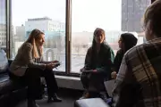 group sitting at window