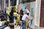 artists painting mural capa