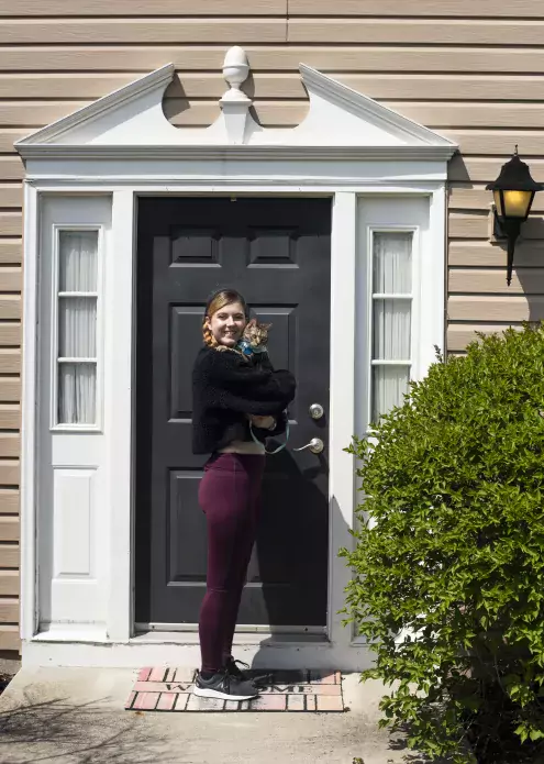 taylor preston on front porch with cat